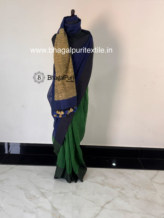 Royal navy blue pure linen handloom saree with emerald green giccha pallu and traditional woven border.