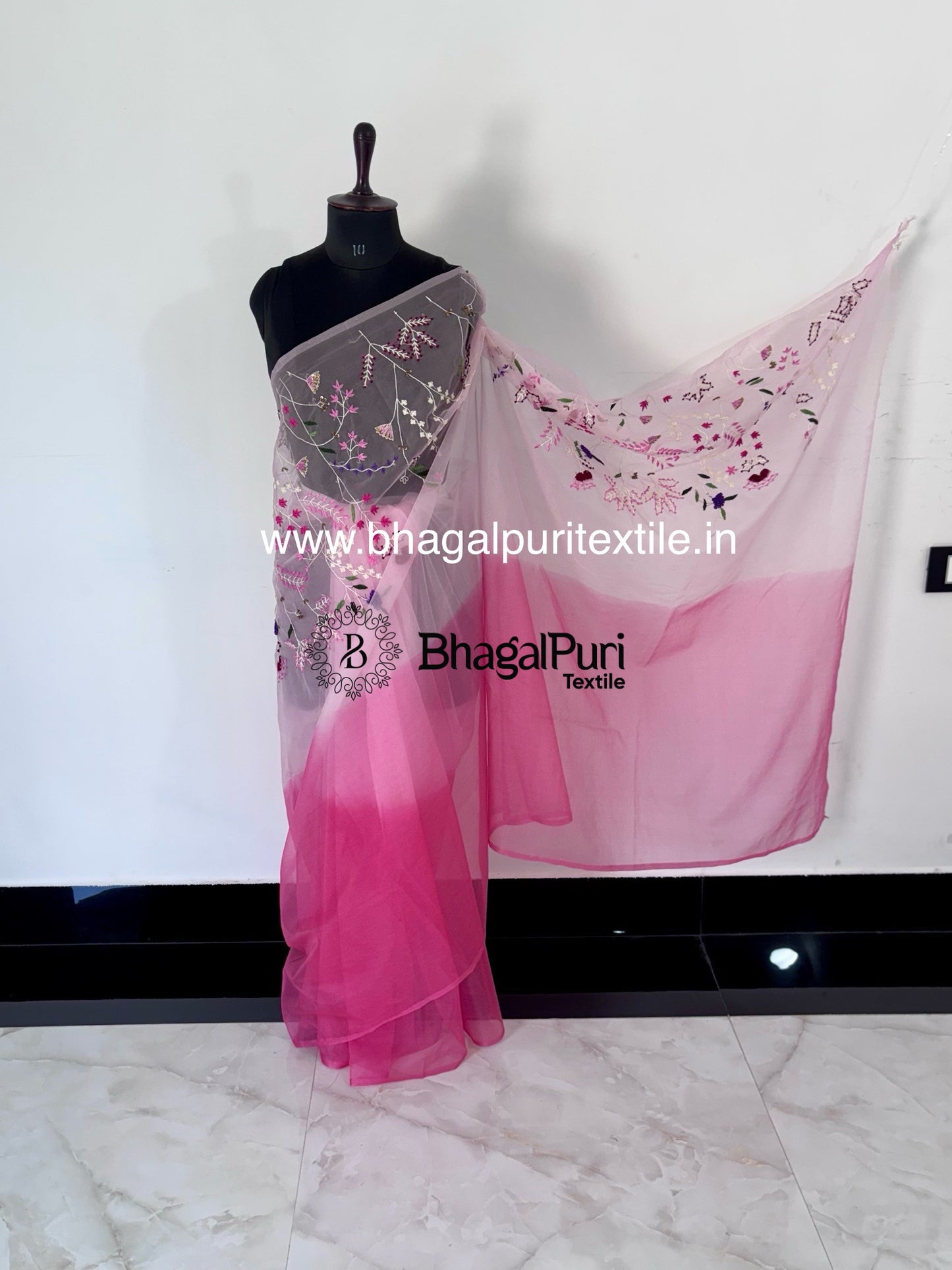 White and pink organza saree in stylish partywear design with lightweight drape and elegant finish.