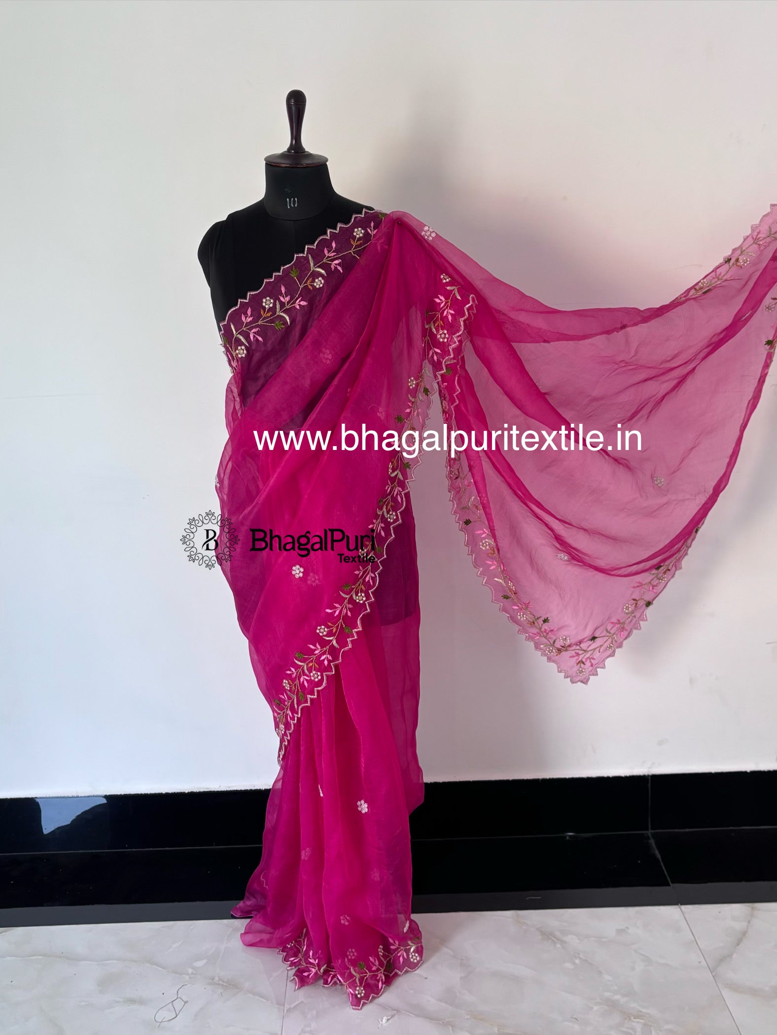 Rani pink saree with pearl detailing.