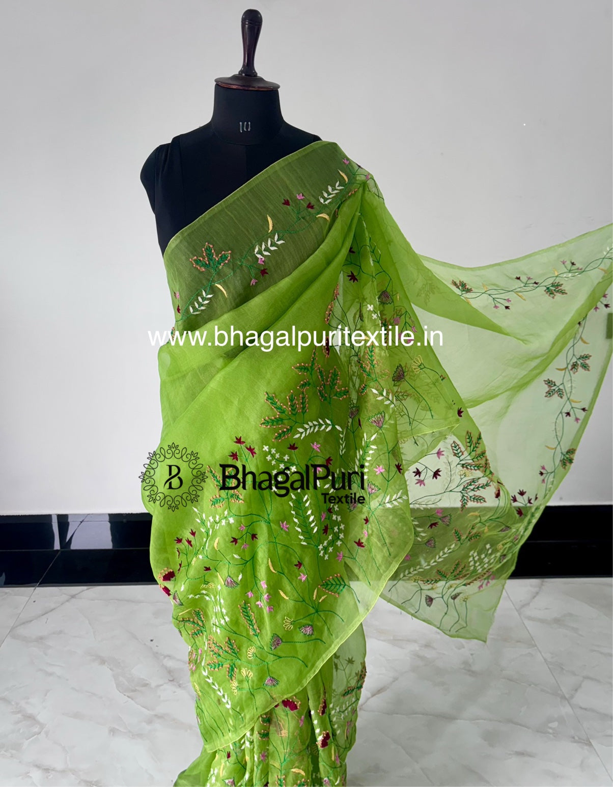 Lightweight organza silk saree with delicate hand embroidery for graceful ethnic style.