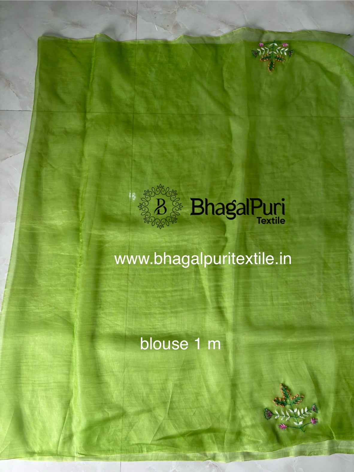 Beautiful organza silk saree with fine hand embroidery for bridal and festive wear.