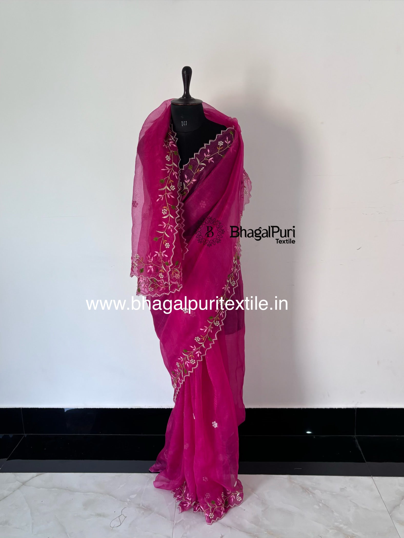Premium organza saree with hand embroidery.