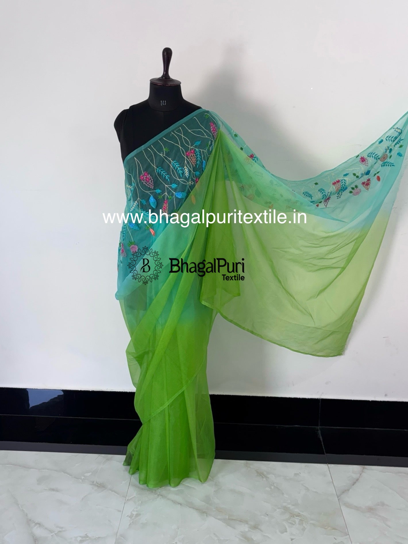 Elegant mauve saree featuring emerald green hand embroidery with matching blouse – perfect for festive and traditional wear