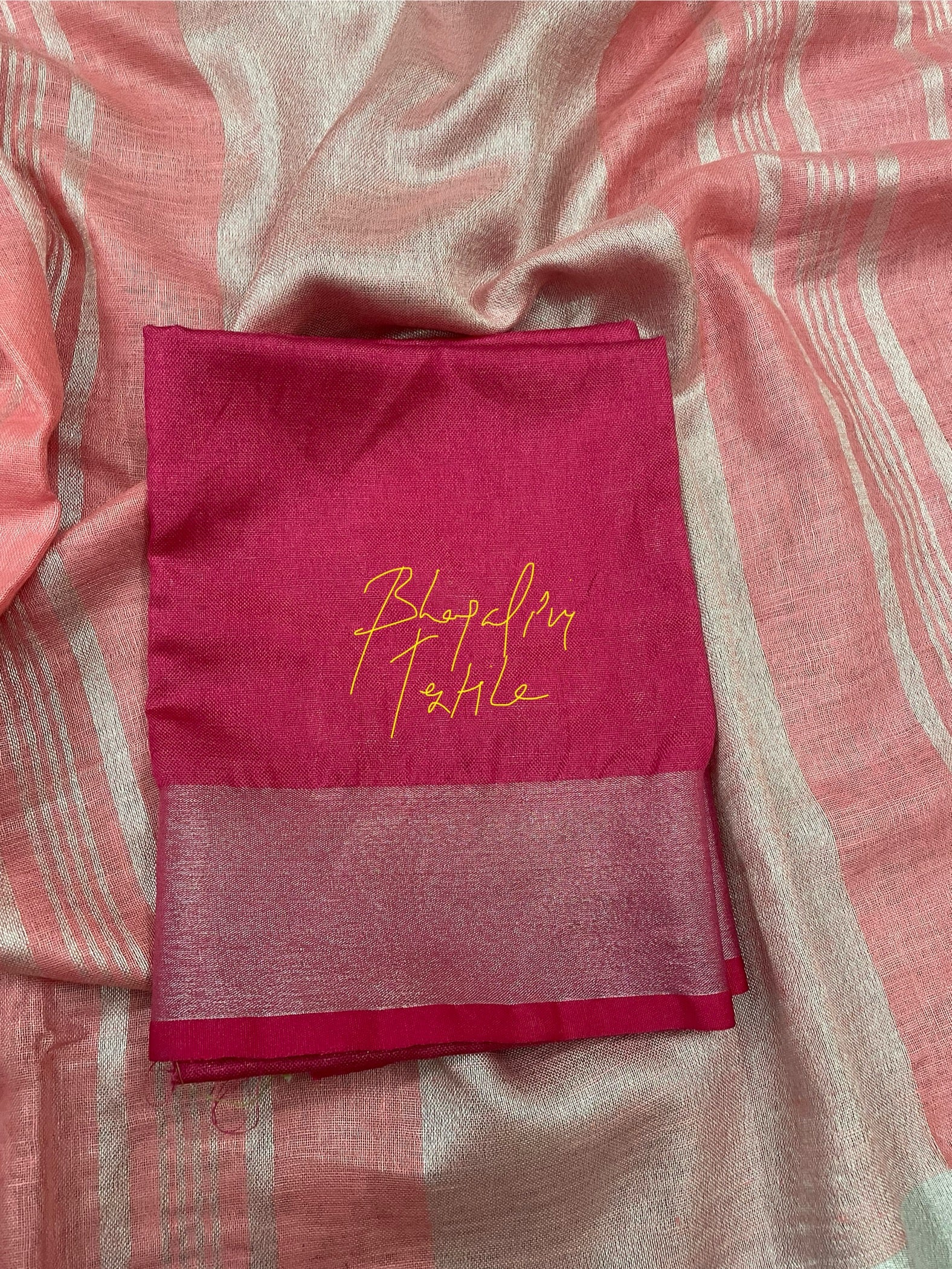 Peach party wear linen saree with subtle handwork, elegant and comfortable for special occasions