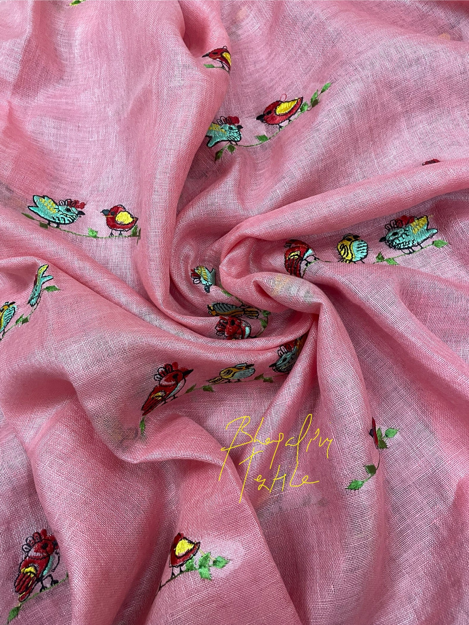 Peach tissue linen saree with designer detailing, ideal for wedding, party and festive occasions
