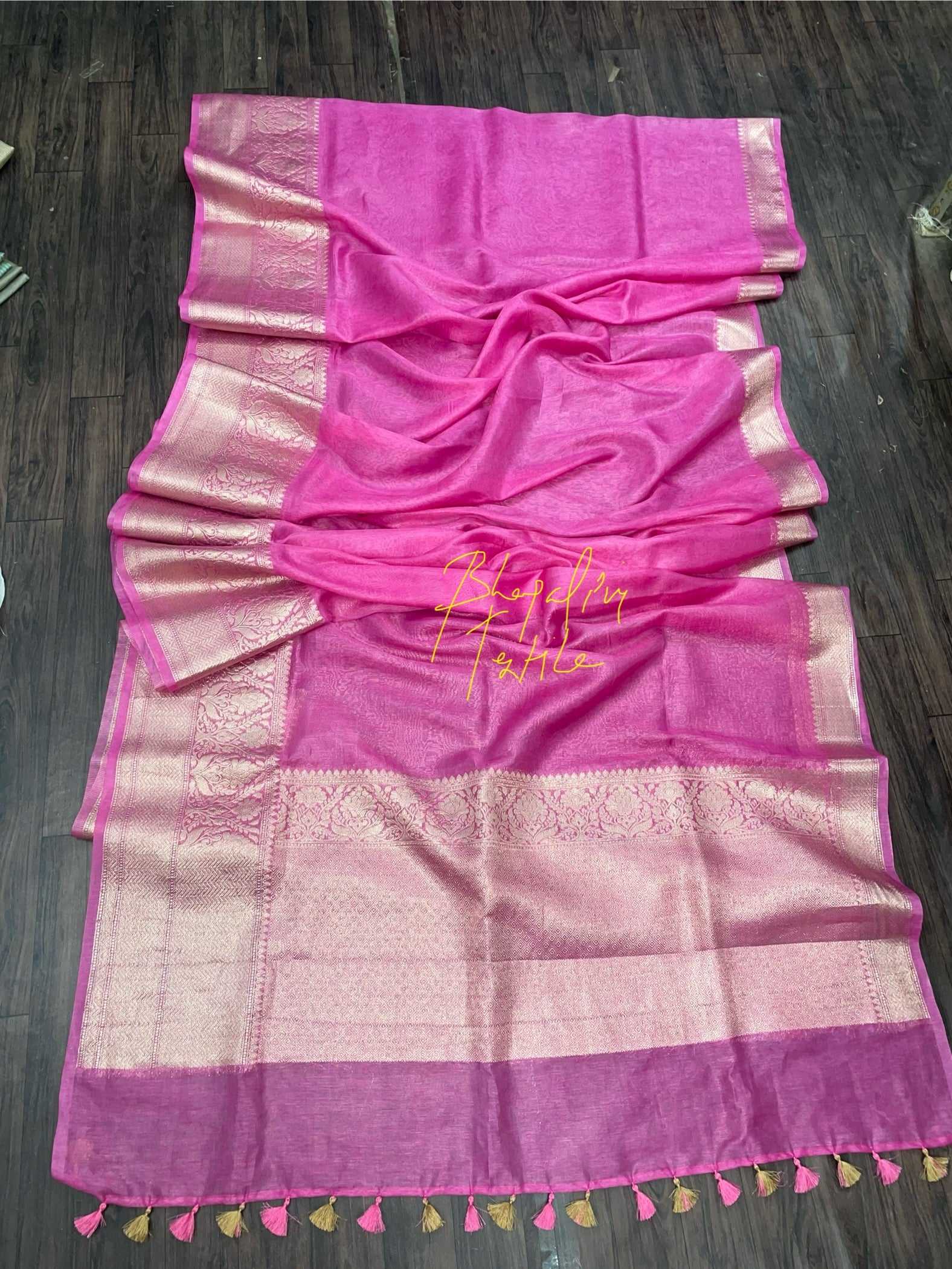 Pink banarasi linen silk saree with traditional woven design perfect for wedding and festive occasions
