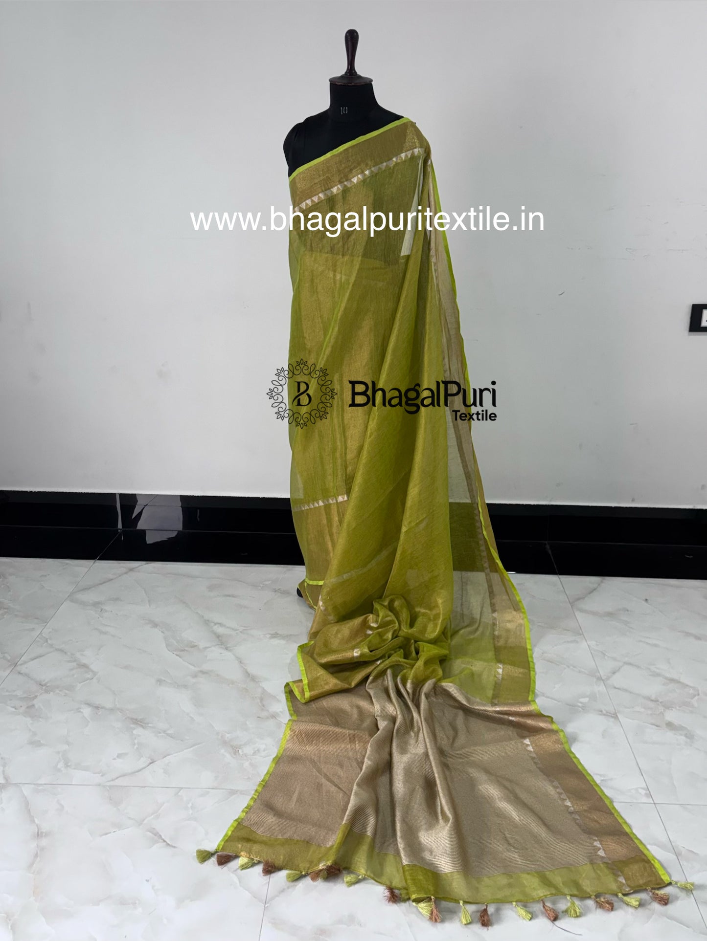 Soft green linen tissue saree with temple design border premium ethnic saree India