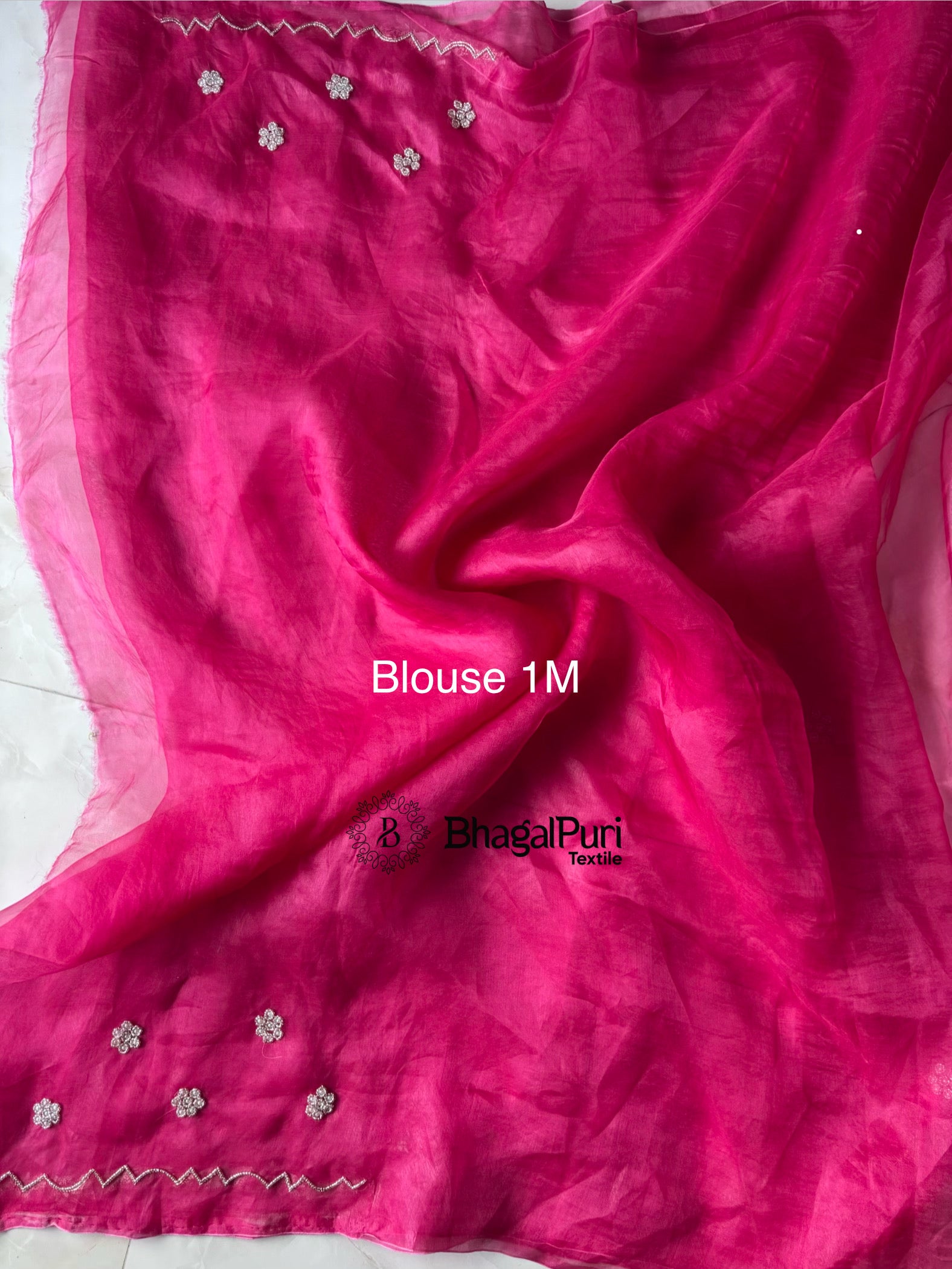 Stylish organza saree with pearl work border.