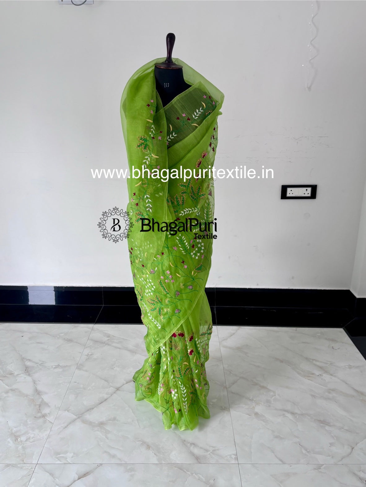Elegant hand embroidered organza silk saree perfect for weddings and special occasions.
