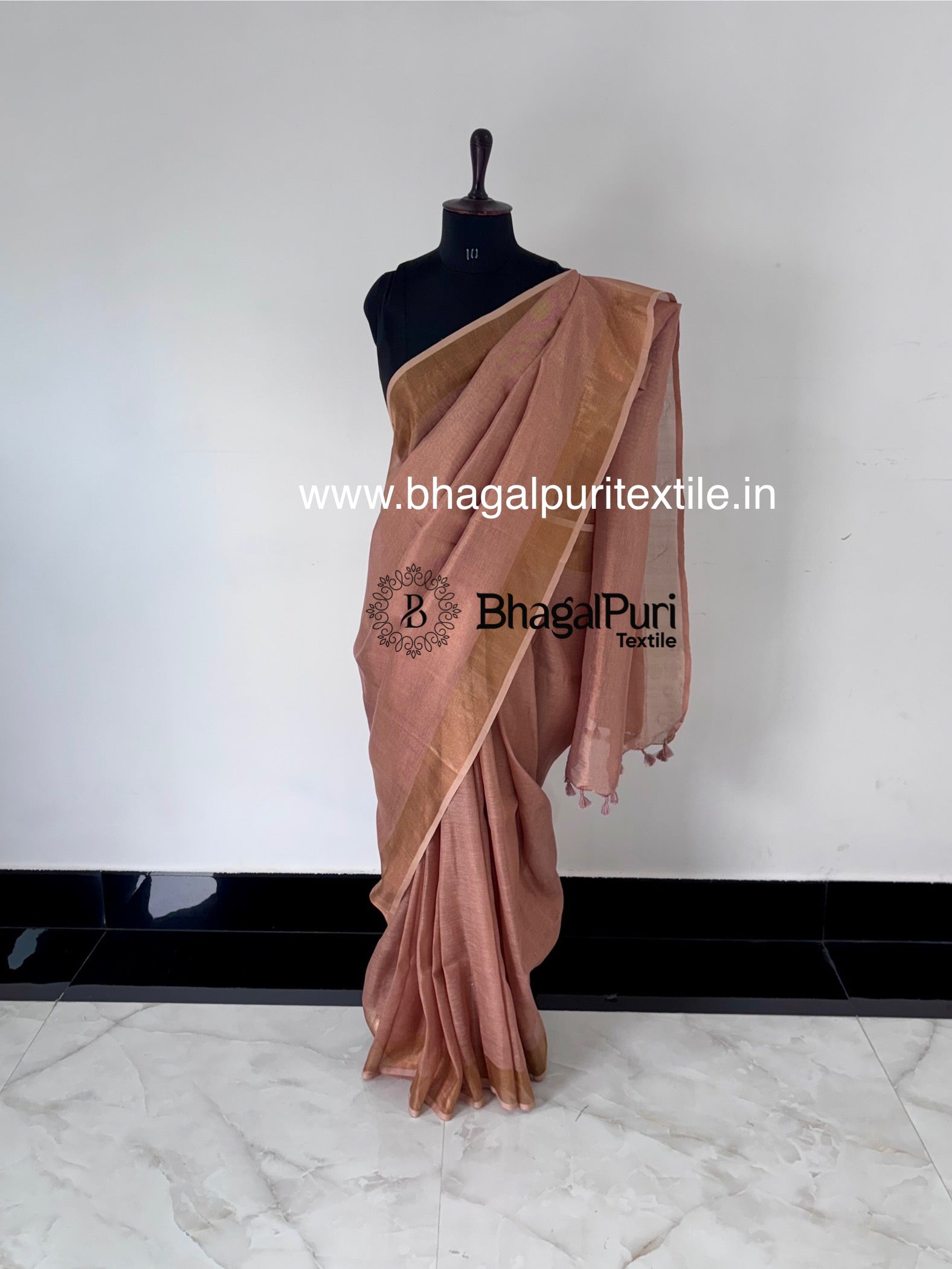 Lightweight tissue silk saree in rose pink with copper undertones, perfect for weddings and parties.