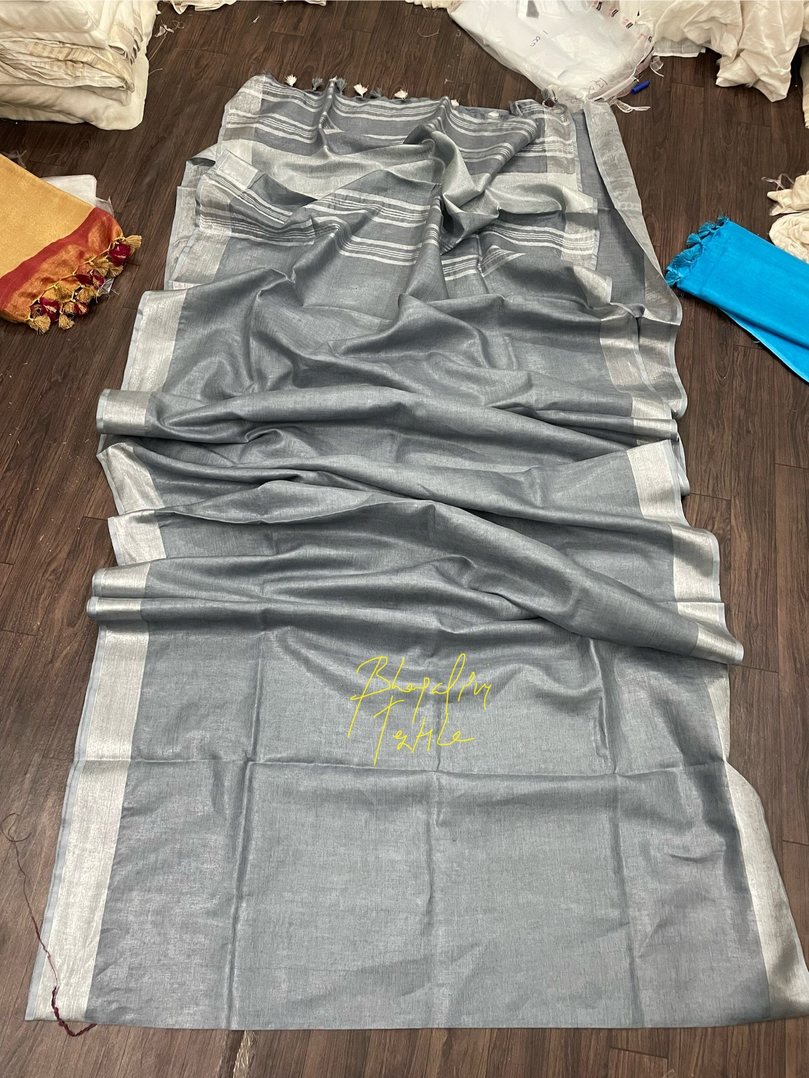 Urban ash grey linen saree with minimalist design, soft lightweight fabric ideal for daily and festive wear