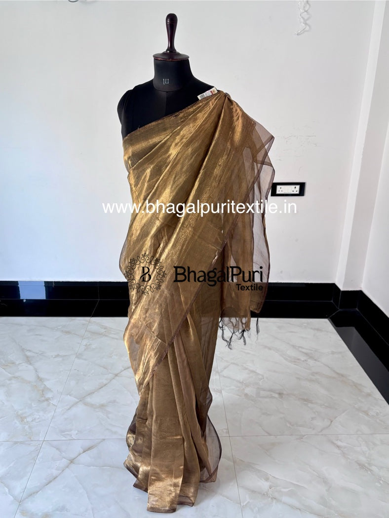 Gold saree on a mannequin against a white background with 'Bhagalpur Textile' branding.