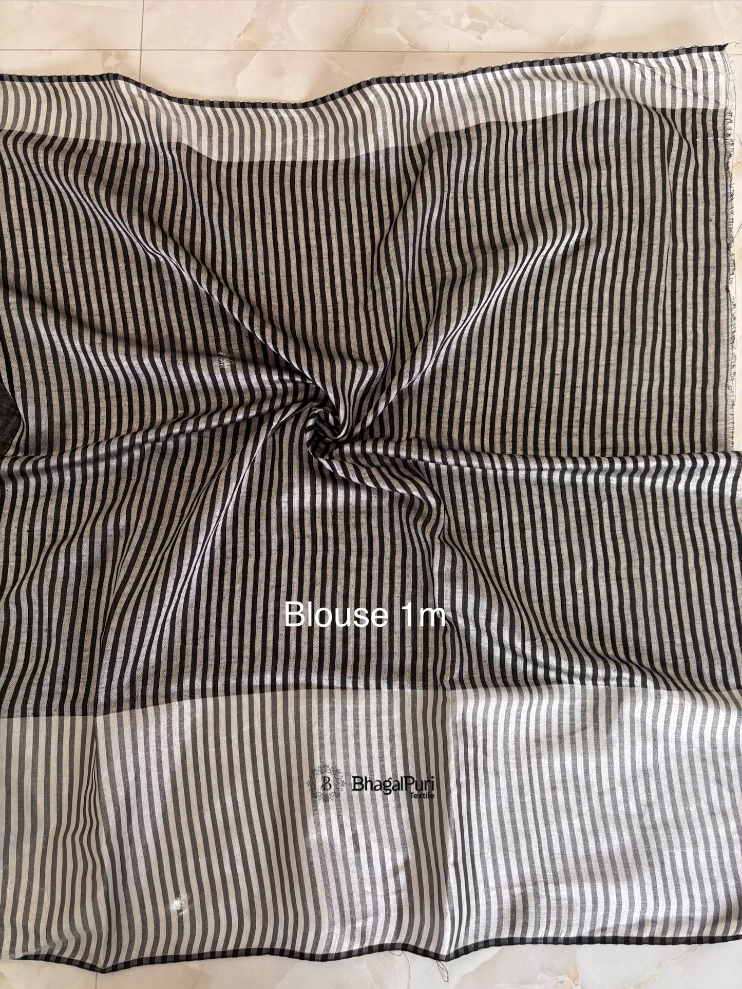 black linen blouse with rich silver zari broad border perfect for wedding and party wear.
