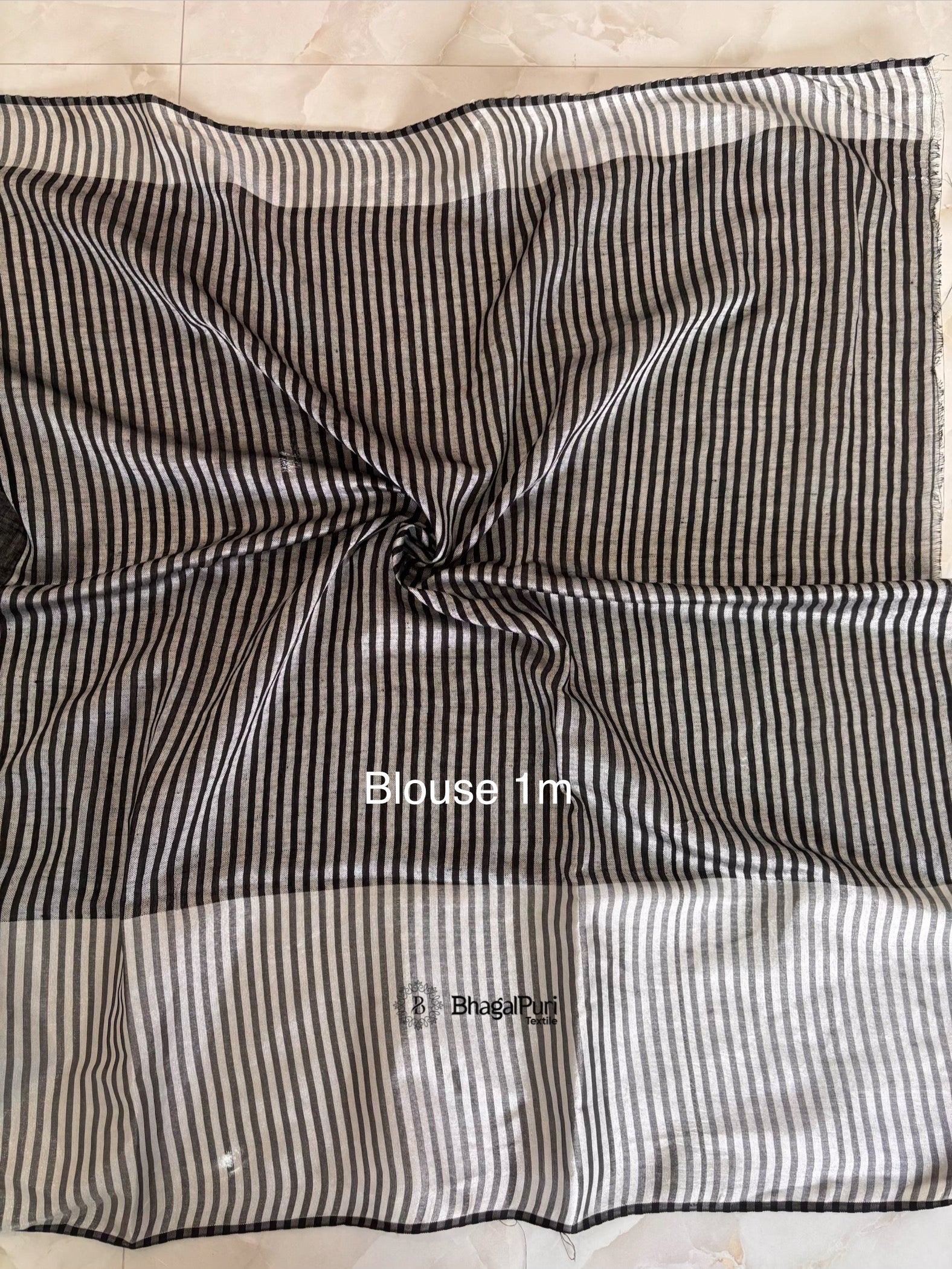 black linen blouse with rich silver zari broad border perfect for wedding and party wear.
