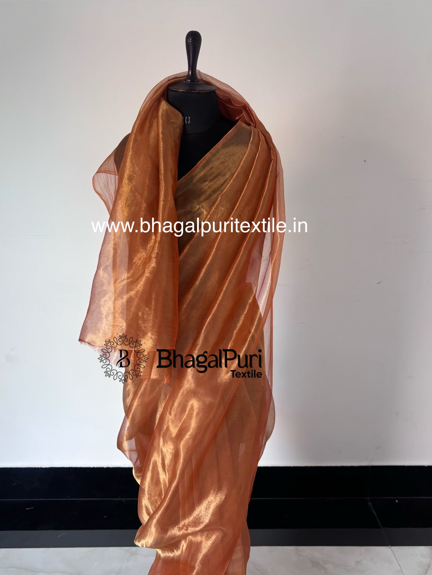 designer sunset tissue silk saree in orange golden color, lightweight luxury saree for wedding and celebrations.