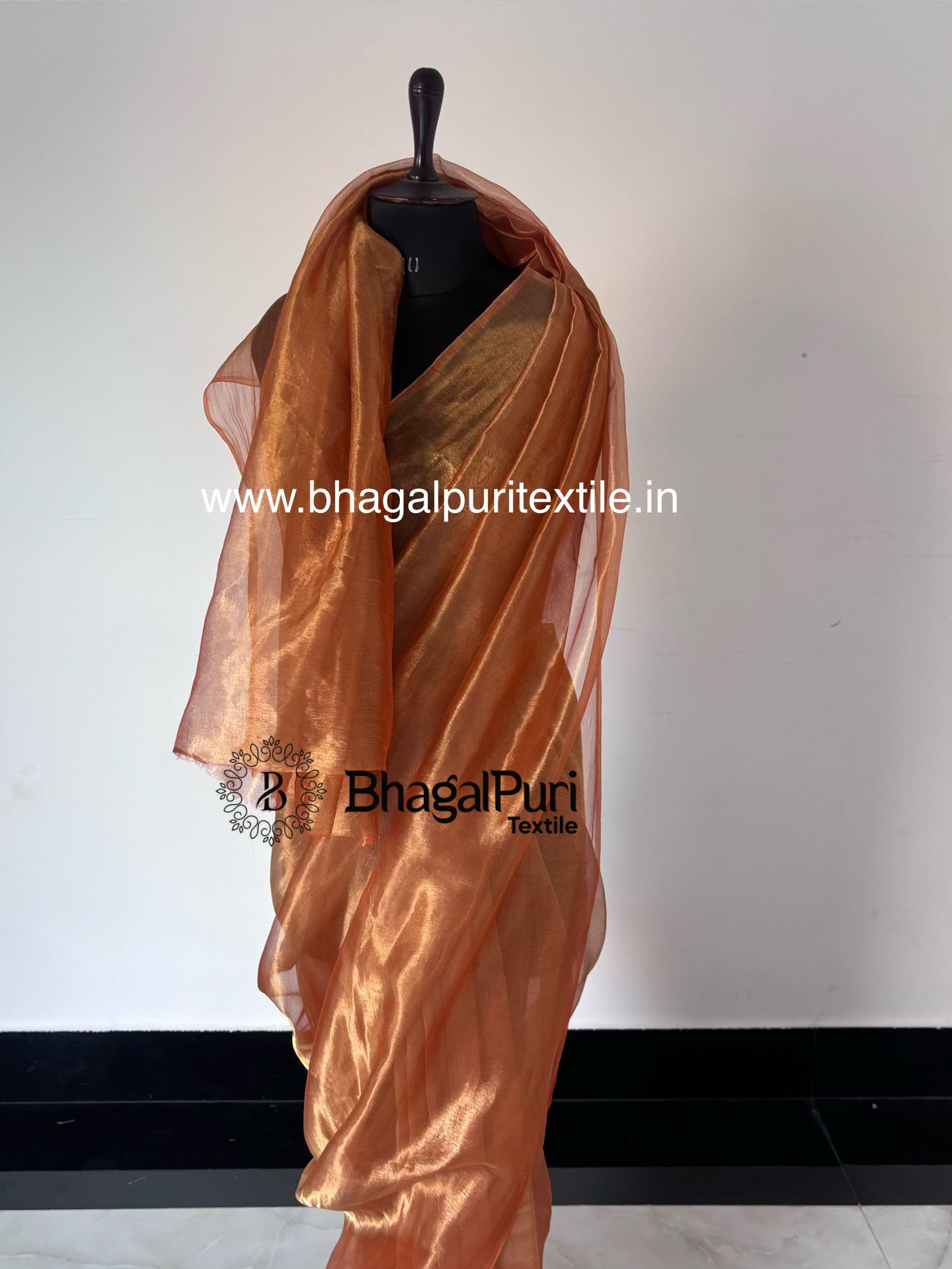 designer sunset tissue silk saree in orange golden color, lightweight luxury saree for wedding and celebrations.