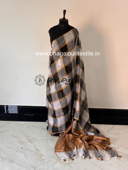 Premium black and white check pattern linen saree with elegant zari border for party and festive wear.