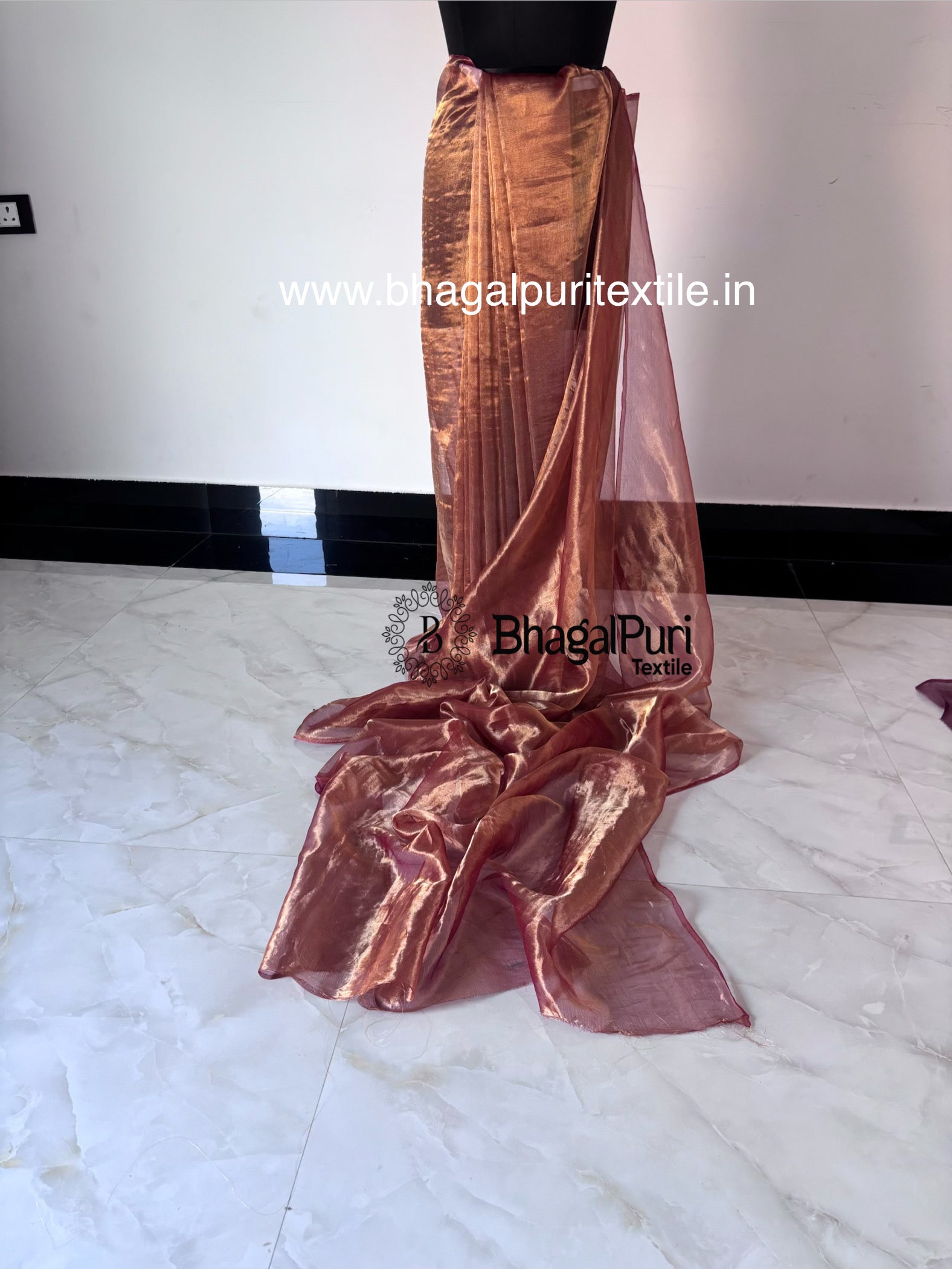Premium red tissue silk saree for wedding and festive wear with matching running blouse fabric.