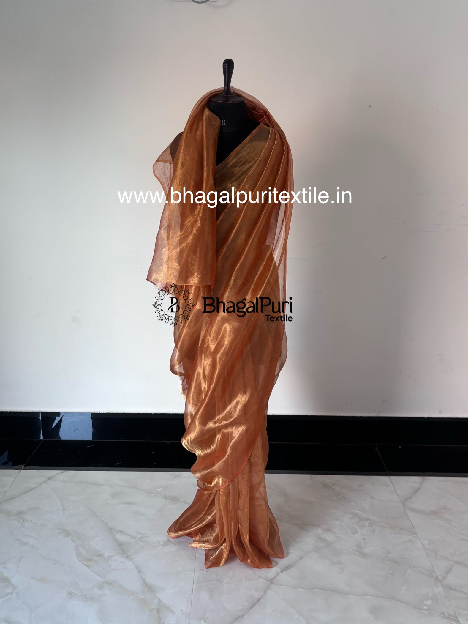Velvya sunset orange tissue silk saree with elegant shimmer, designer tissue silk saree for wedding and festive wear.